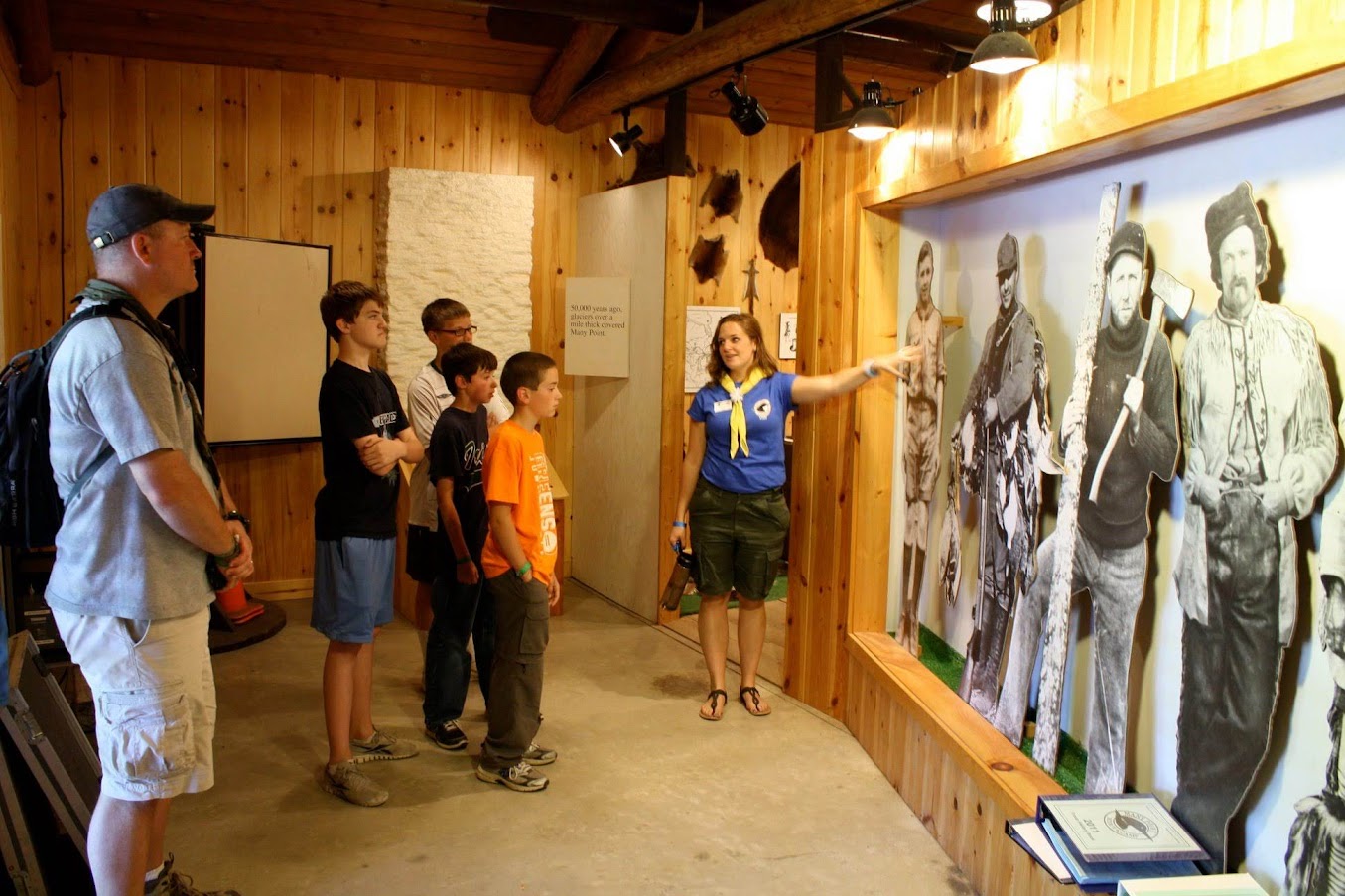 A staff member giving a tour of the Many Point History Center